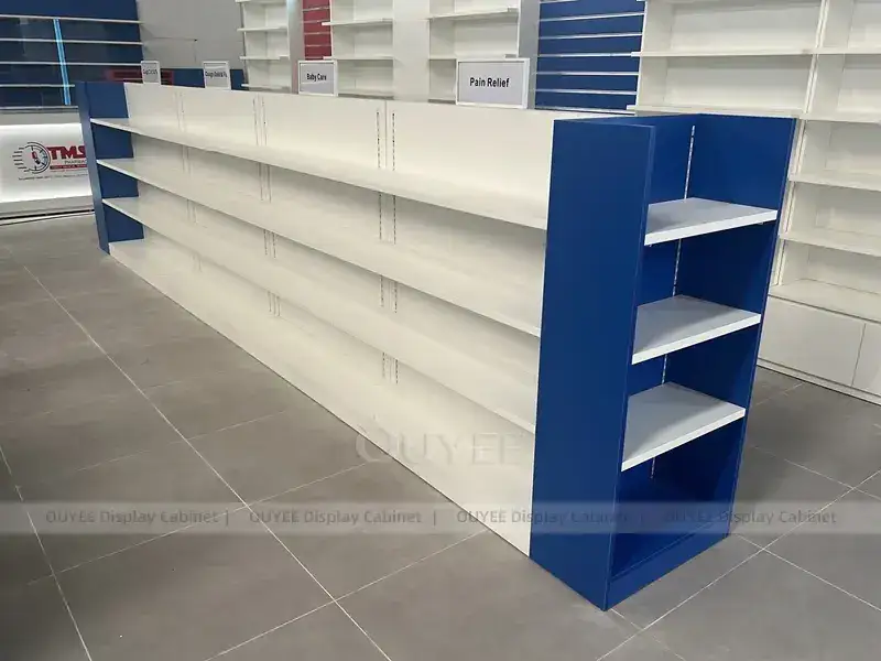 Scaffalatura da farmacia blu e rossa con pensile illuminato 1