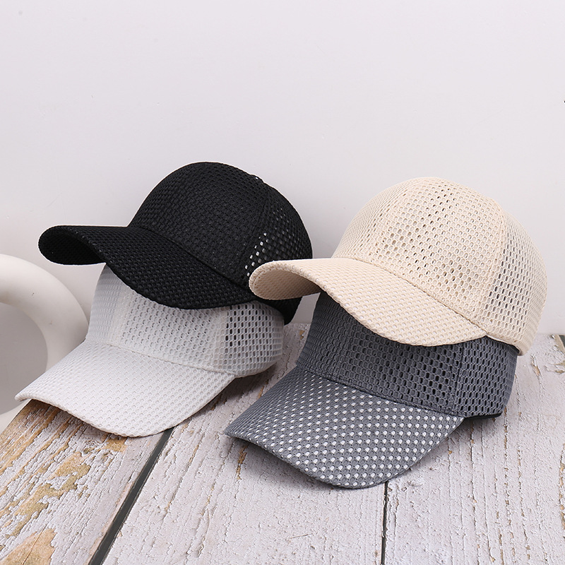 Black, white, beige and gray baseball caps with open mesh crowns and curved brims