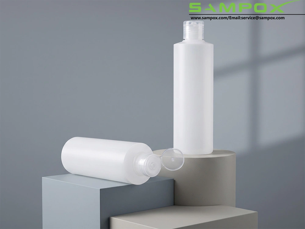Flacone dosatore a pressione versatile in PE con tappo a scatto, capacità 100 ml. 1