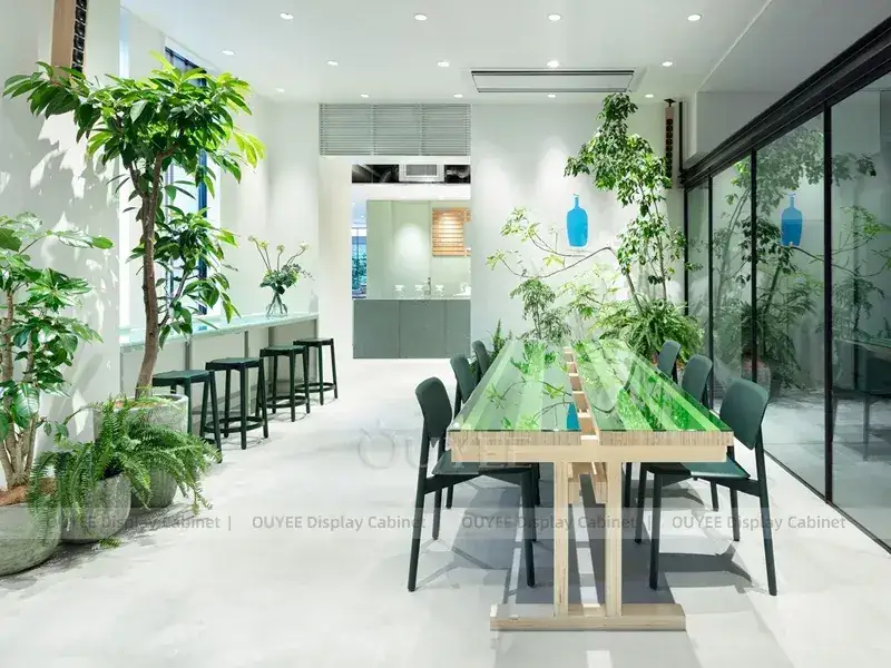 Comptoir de présentation blanc et bleu pour boulangerie et café avec îlot de service à LED vertes 1