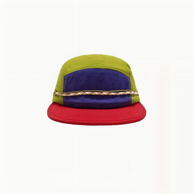 Front view of a camper cap with a green crown, purple front panel, red brim and patterned cord.