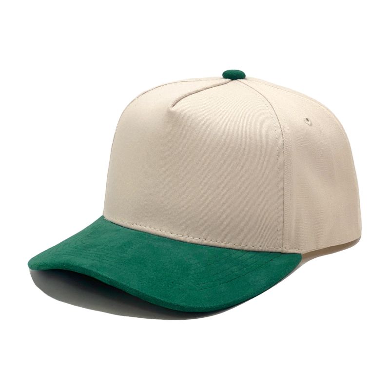 Off-white baseball cap with a green curved brim and matching top button