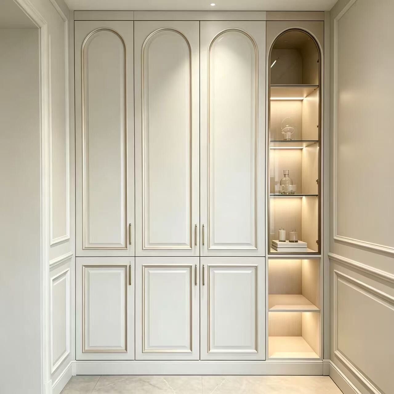 French walk in closet with arched door
