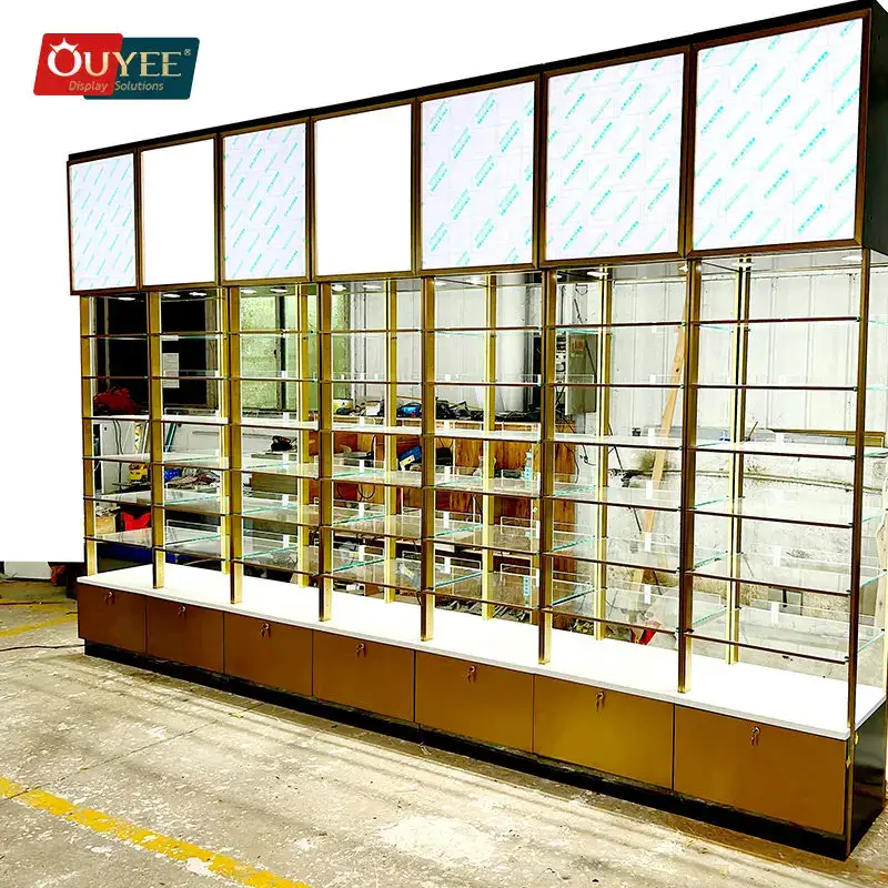 Vitrine de parede para perfumes em aço inoxidável dourado 1