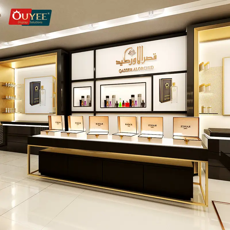 رف عرض مخصص للعطور ومستحضرات التجميل - حامل جداري أسود/ذهبي 1