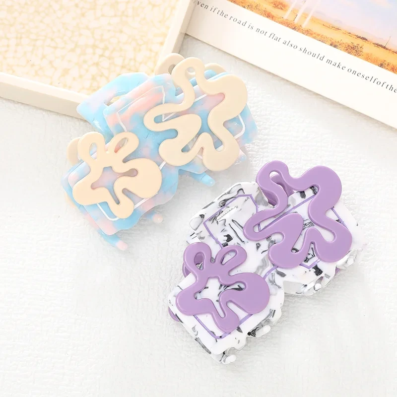 Dowell nouveau Style coréen doux irrégulier fleurs creuses mignonnes griffes de cheveux en acétate 1