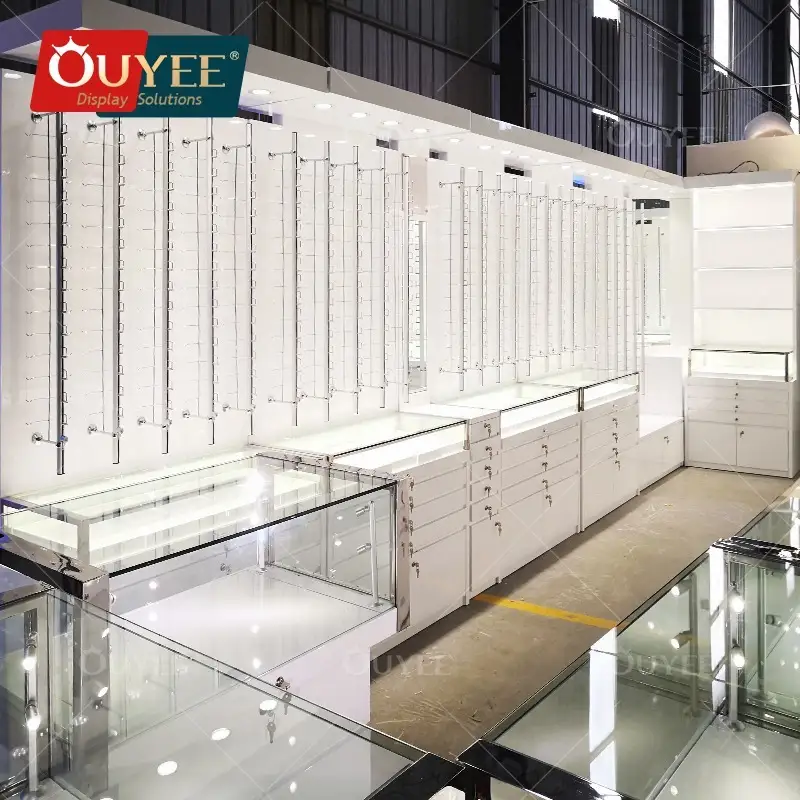 Mobili per negozio di ottica, aste espositive per occhiali da sole, bancone espositivo. 1