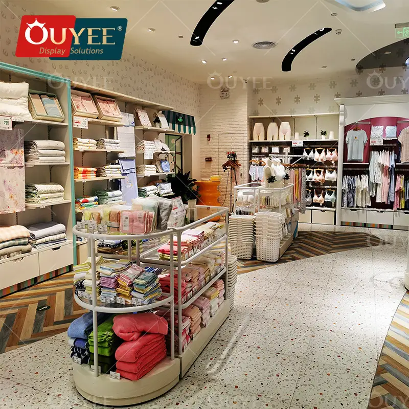 رفوف عرض ملابس أطفال خشبية مصممة خصيصًا لمحلات بيع ملابس الأطفال والرضع 1