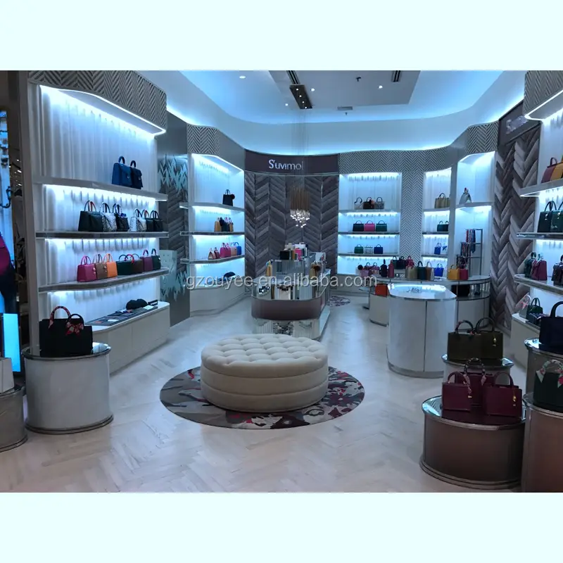 Prateleiras de madeira para exposição de sapatos e bolsas com balcão de caixa. 1