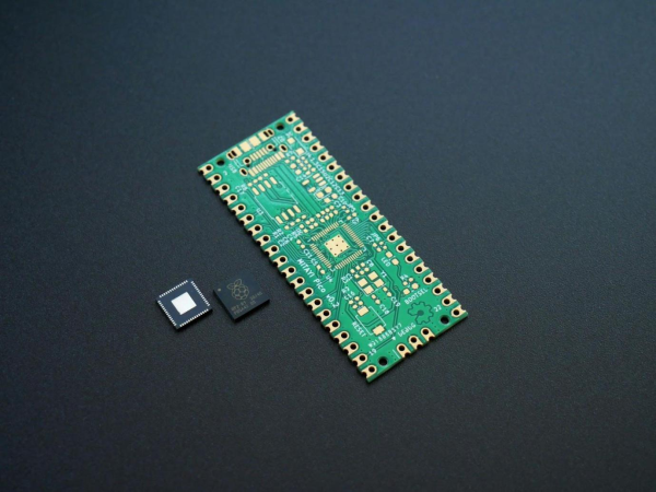 Green PCB board and microcontrollers on the table.