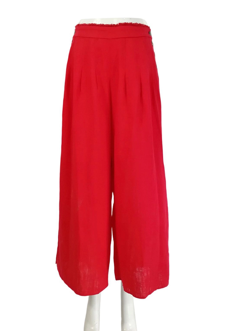 Women daily outfit red wide leg trousers moves gracefully 1