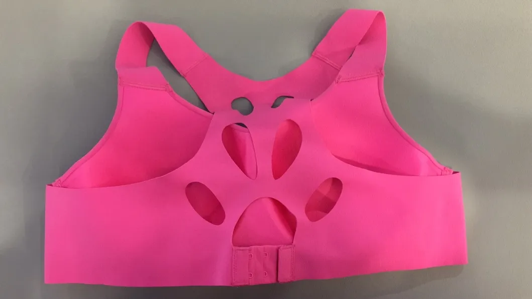  Soutien-gorge de sport sans coutures pour femme, à dos croisé et perforations laser