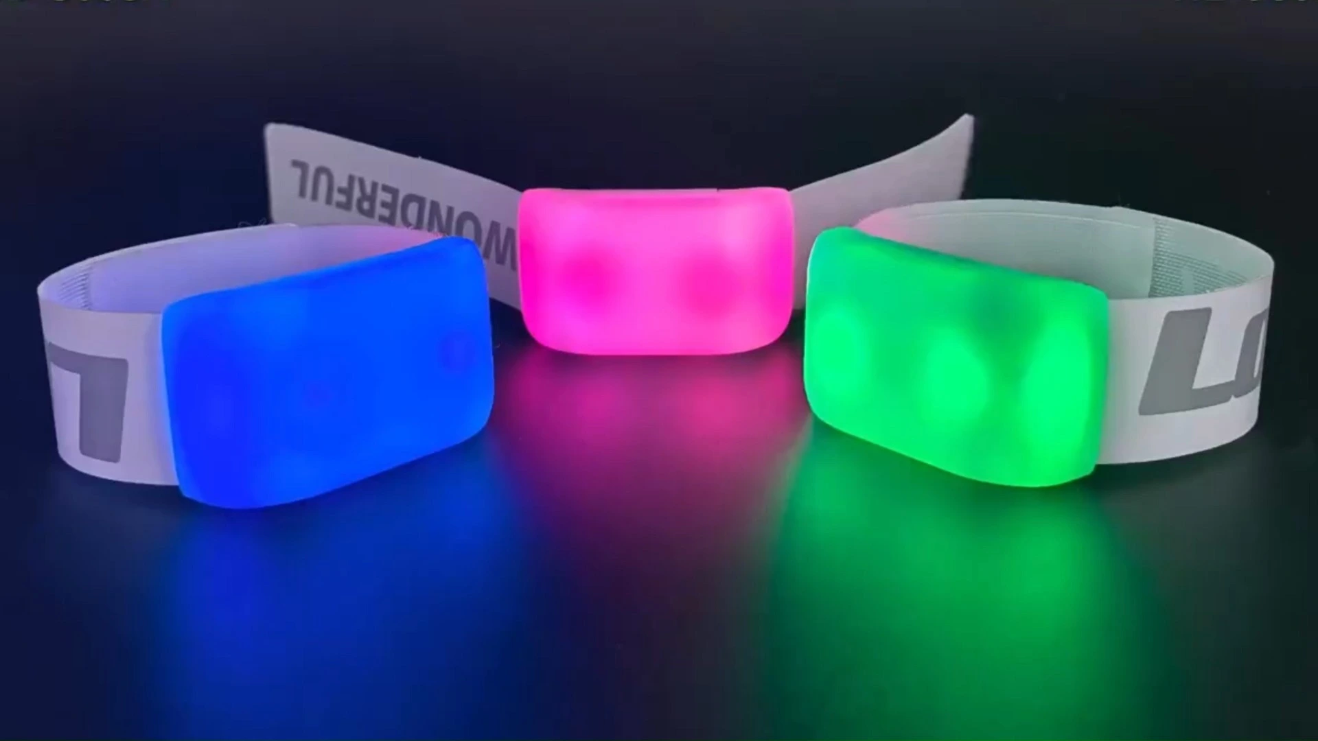 Stadium crowd demonstrating zero-lag DMX512 synchronization with custom elastic LED wristbands.