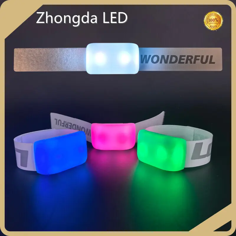 Stadium crowd demonstrating zero-lag DMX512 synchronization with custom elastic LED wristbands.