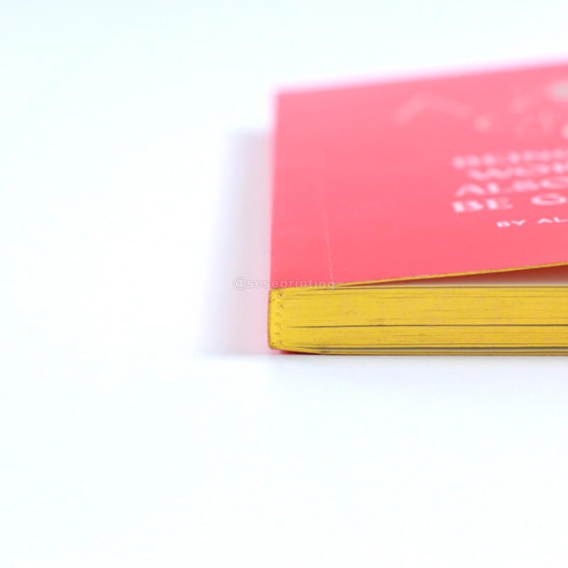 Paperback Book with Gold Foiled Cover, Gilded Edges, and Ribbon 11