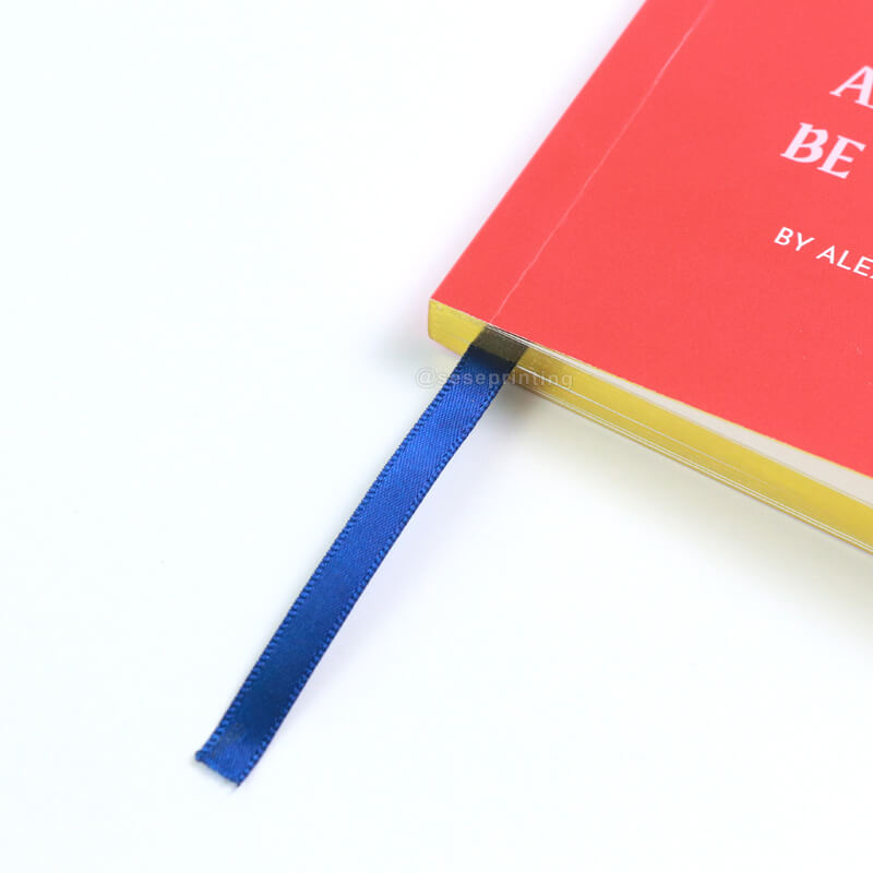 Paperback Book with Gold Foiled Cover, Gilded Edges, and Ribbon 10