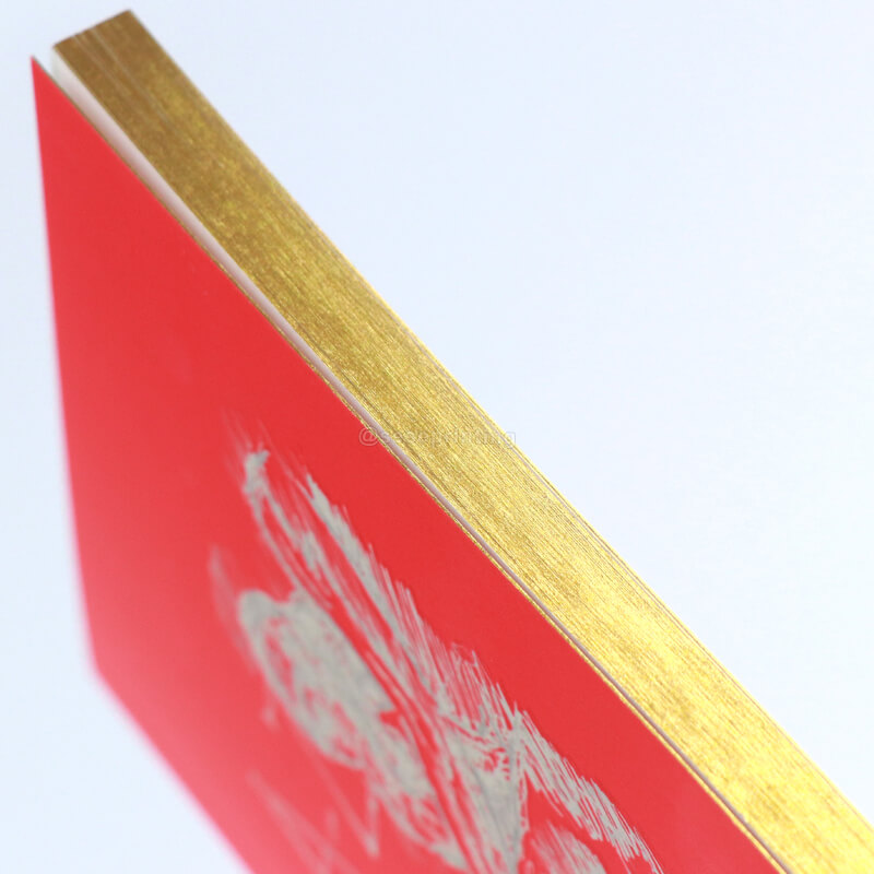 Paperback Book with Gold Foiled Cover, Gilded Edges, and Ribbon 9