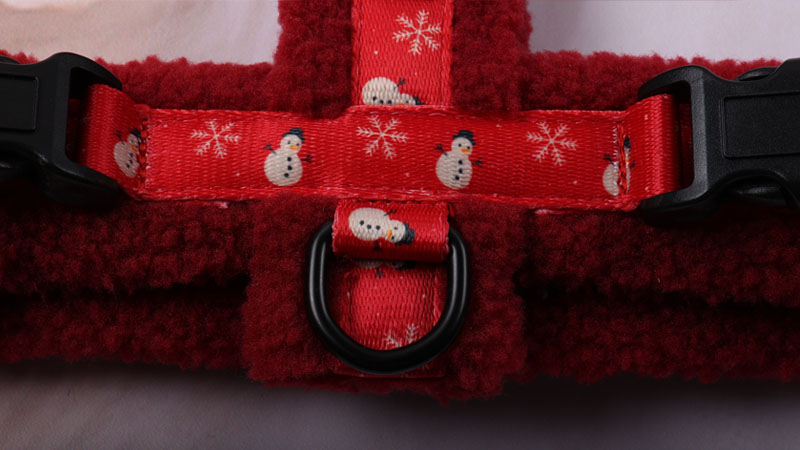 Heavy-duty metal D-ring on the back of the sherpa dog harness for secure leash attachment