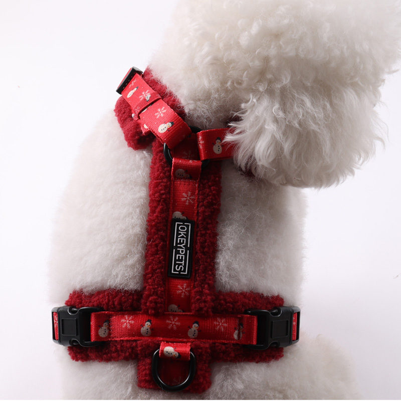 Back view of dog in sherpa dog harness with leash attached to the D-ring during a winter walk
