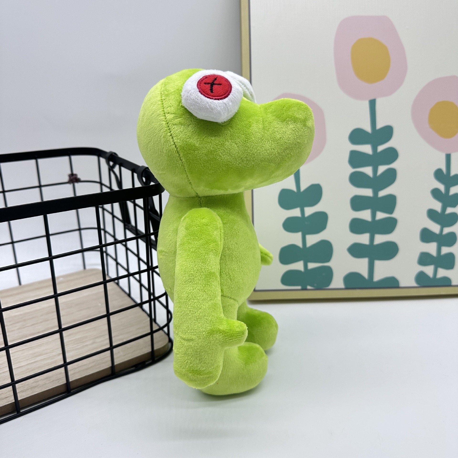 Peluche Petite Grenouille Verte Vibrante Runmo - Poupée en Peluche de 26 cm avec des yeux en croix rouge 28