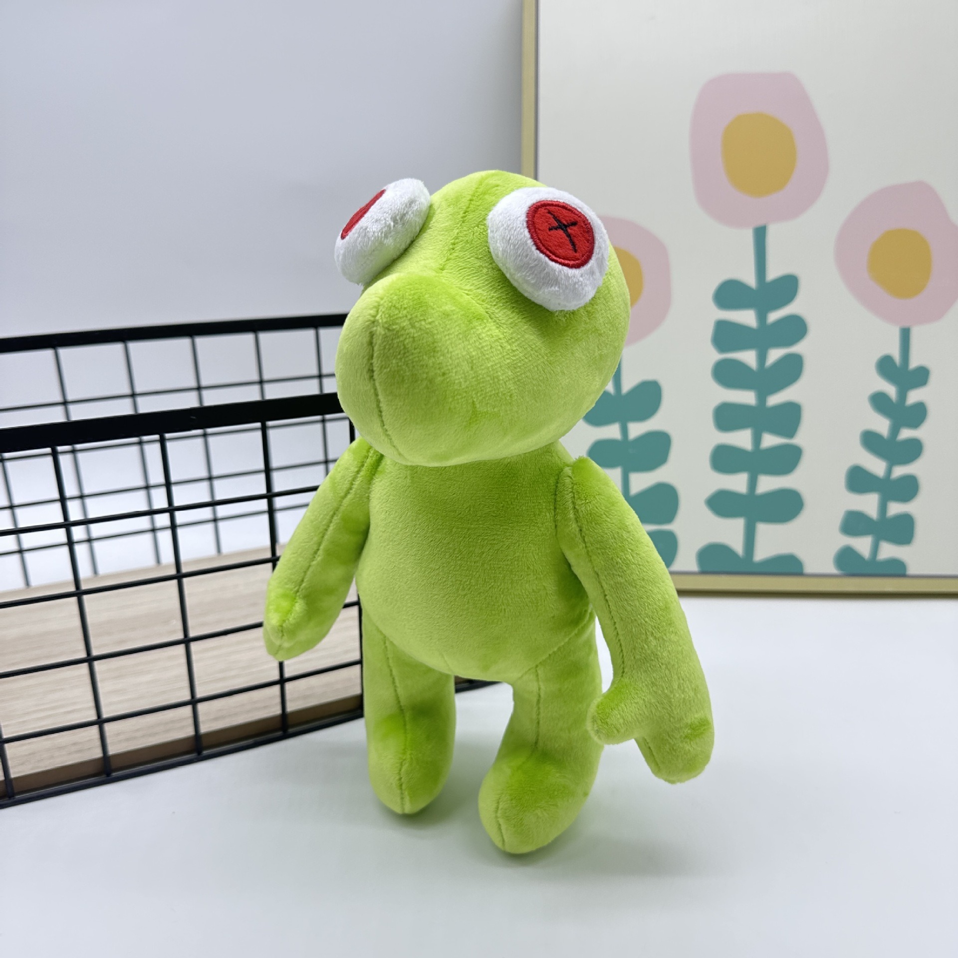Peluche Petite Grenouille Verte Vibrante Runmo - Poupée en Peluche de 26 cm avec des yeux en croix rouge 27