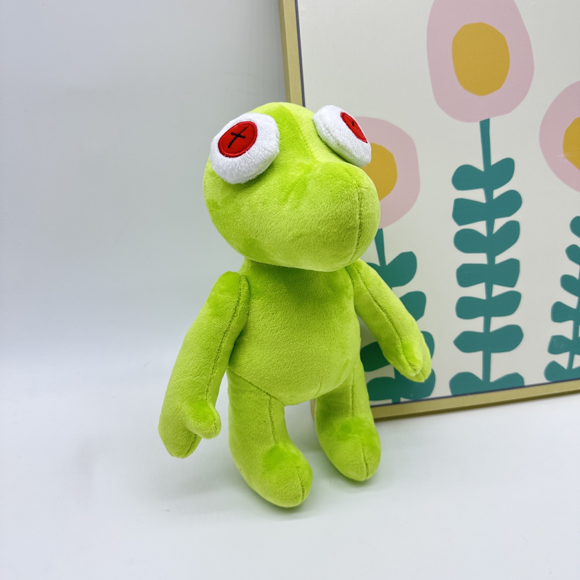 Peluche Petite Grenouille Verte Vibrante Runmo - Poupée en Peluche de 26 cm avec des yeux en croix rouge 19