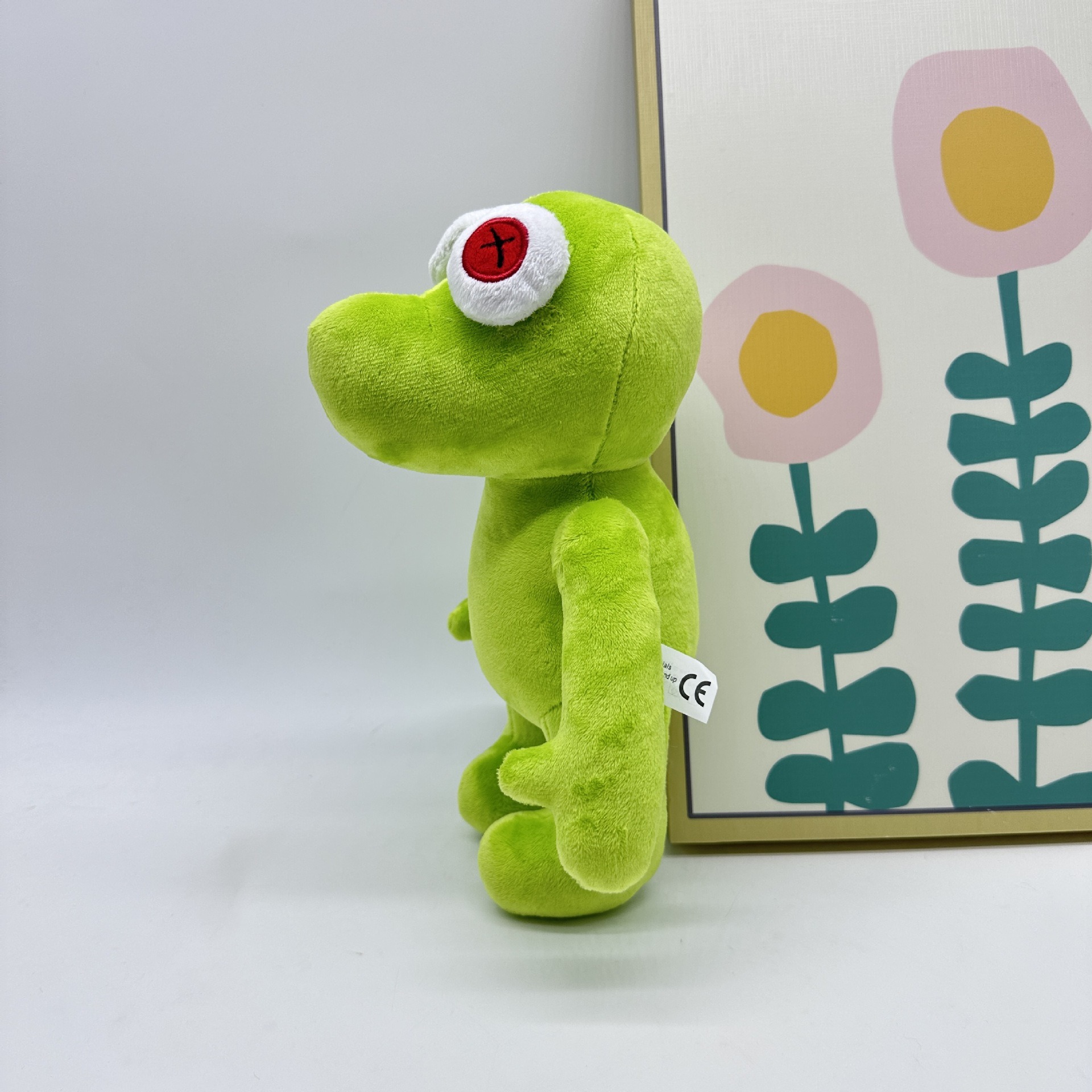 Peluche Petite Grenouille Verte Vibrante Runmo - Poupée en Peluche de 26 cm avec des yeux en croix rouge 15