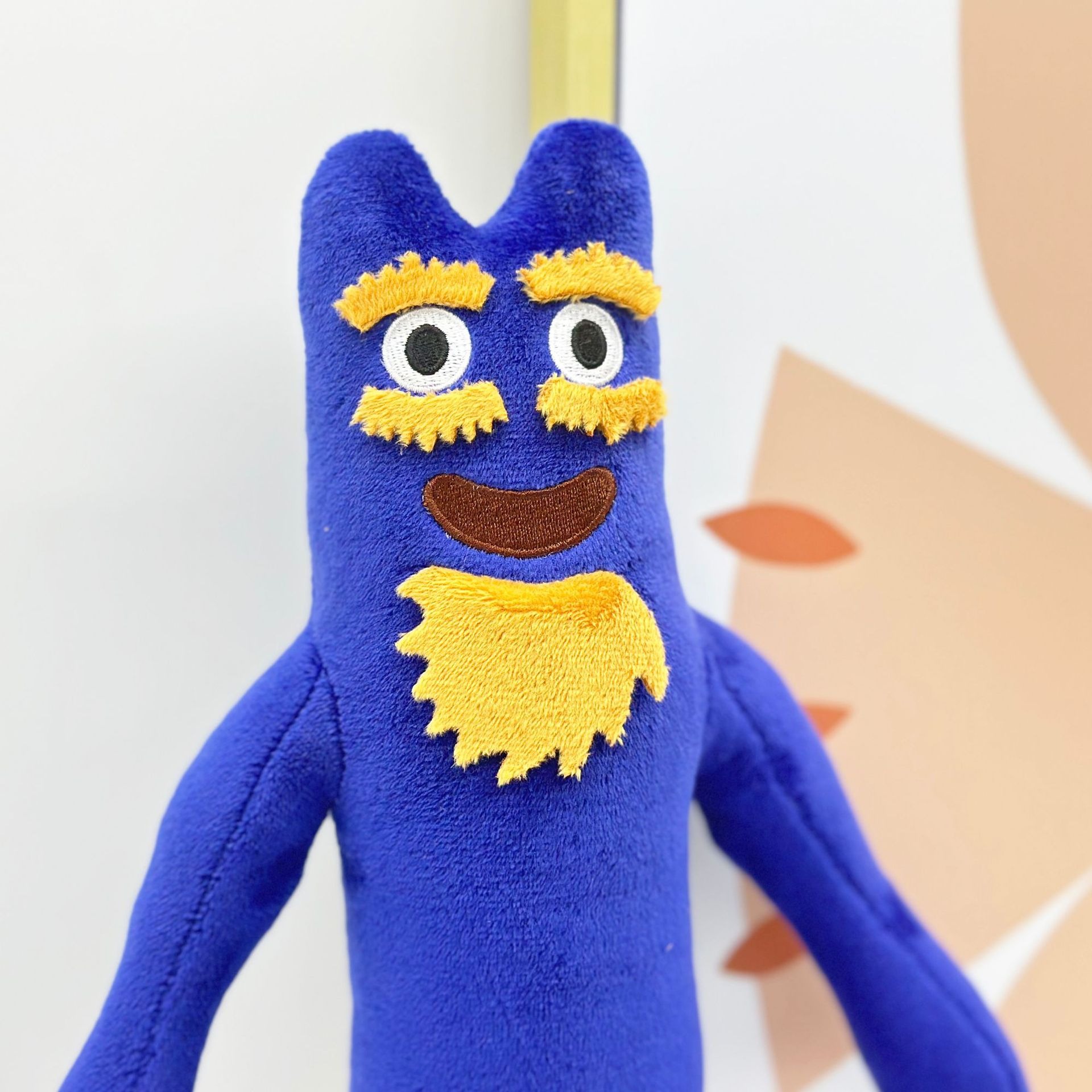 Adorable monstruo azul de peluche con barba y cejas amarillas. 34 cm de alto y 101 g de peso. Figura suave para niños. 14