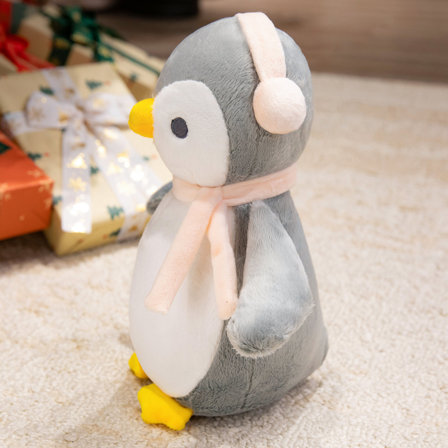 A plush doll in the unique shape of a penguin wearing headphones, a gift for children 15