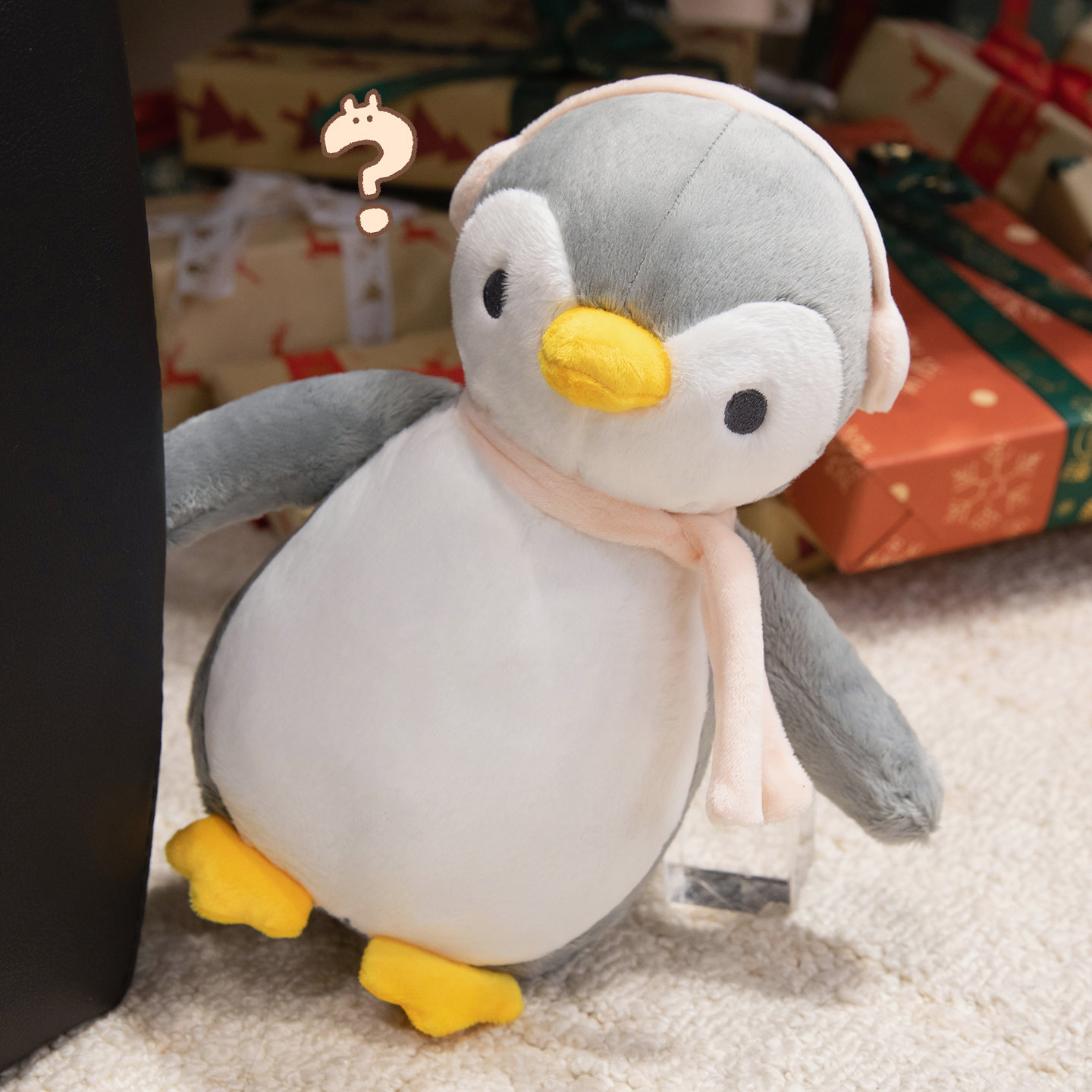 A plush doll in the unique shape of a penguin wearing headphones, a gift for children 14