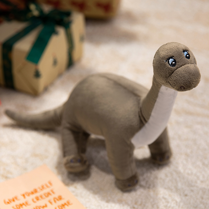 Diseños creativos de múltiples muñecos de peluche con forma de dinosaurio, que son regalos educativos y agradables para los niños. 17