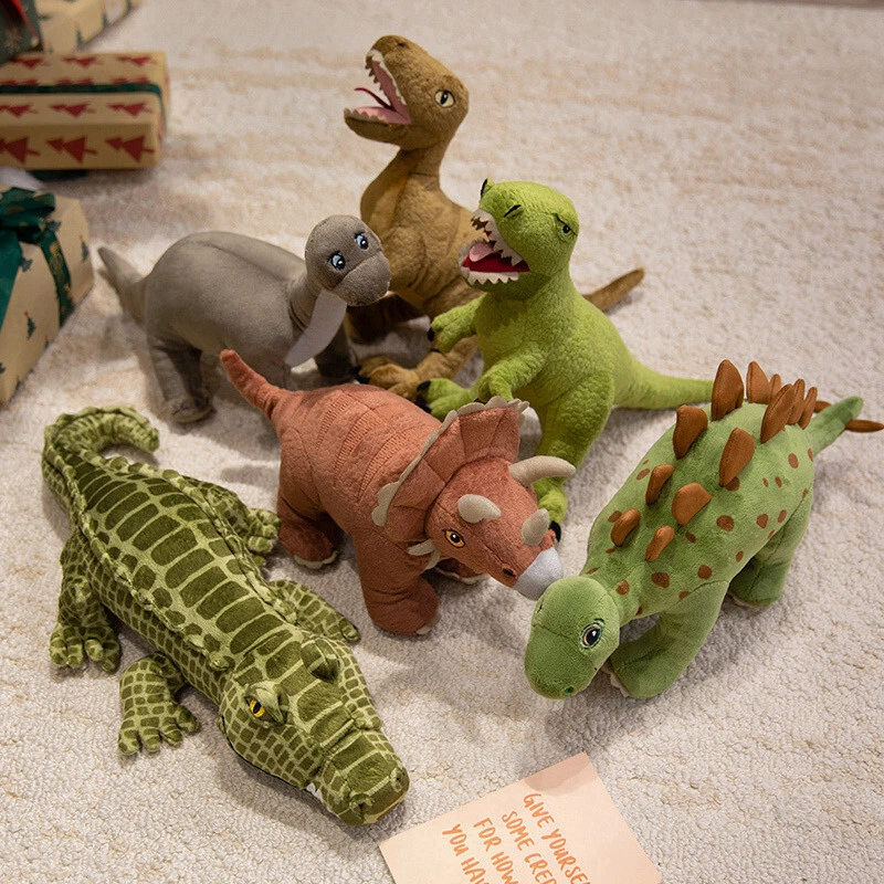Diseños creativos de múltiples muñecos de peluche con forma de dinosaurio, que son regalos educativos y agradables para los niños. 1