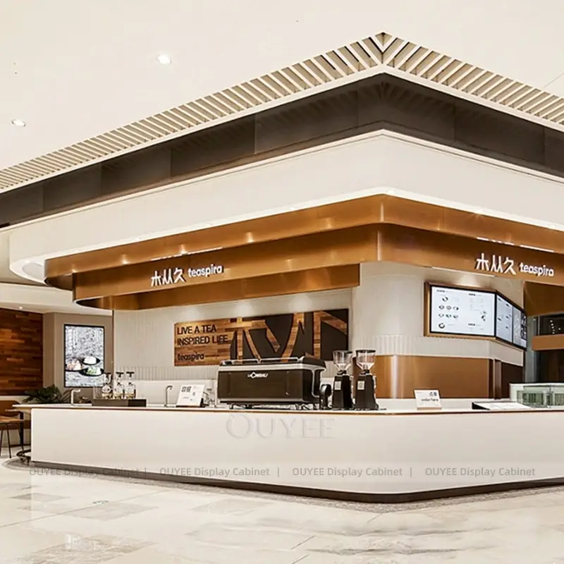 Modern Corner Coffee Kiosk with White Counter and Bronze Trim 1
