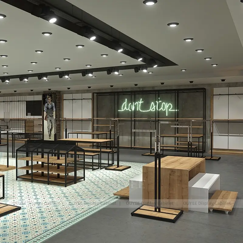 Large Industrial Clothing Display Fixture System with Tables and Garment Racks 1