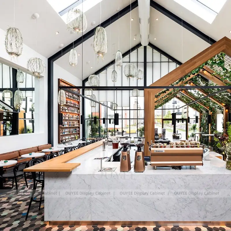 Premium Coffee Shop Counter with Marble Finish and Open High-Ceiling Design 1