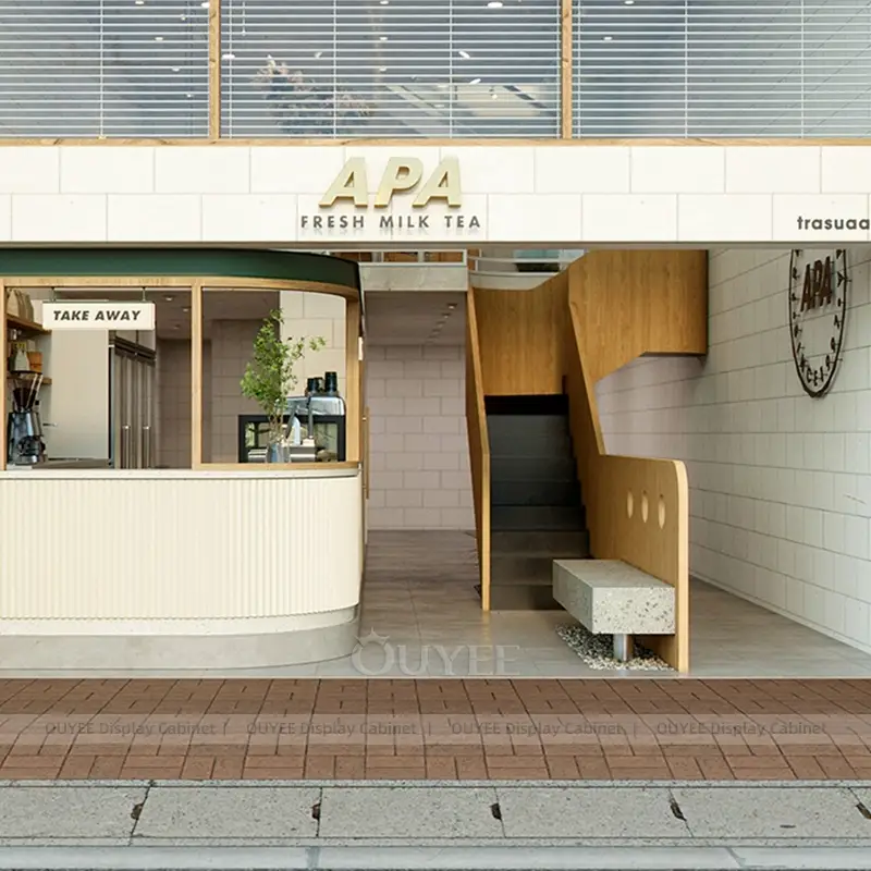 Boutique Coffee Counter with Pastry Display and Green Canopy Detail 1