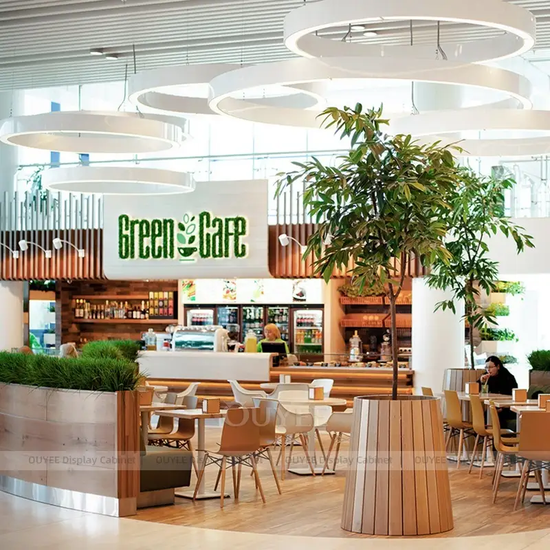 Modern Coffee Shop Counter with Pastry Display and Warm Wood Finish 1