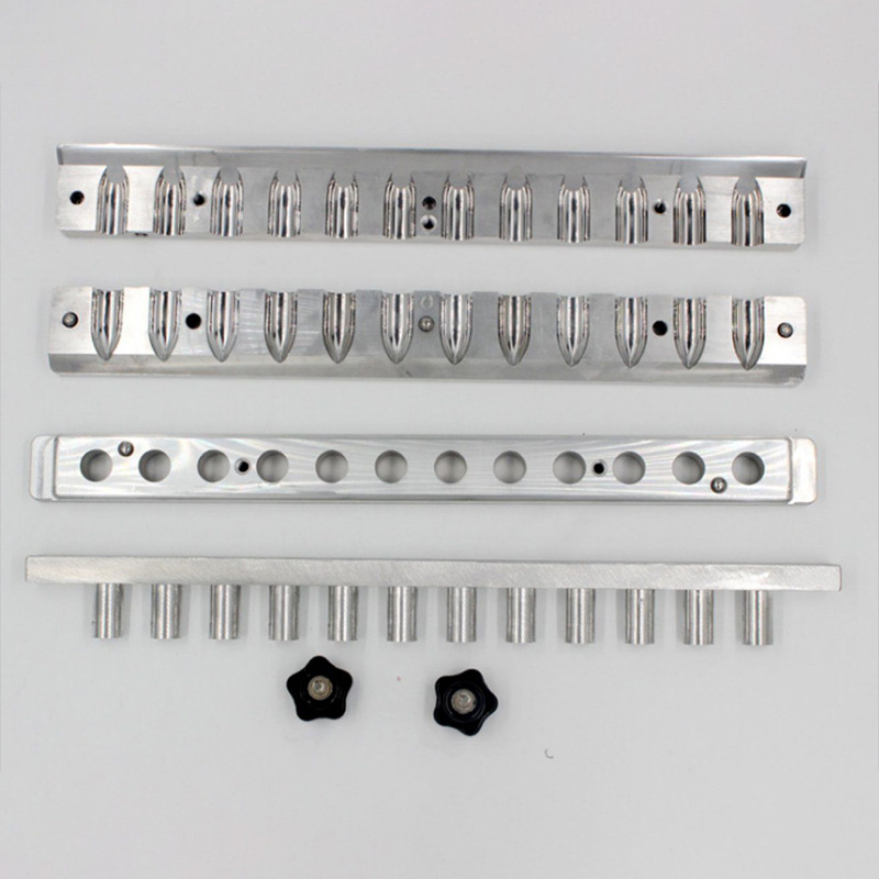 Disassembled 12-cavity aluminum lipstick mold with removable plates and screws