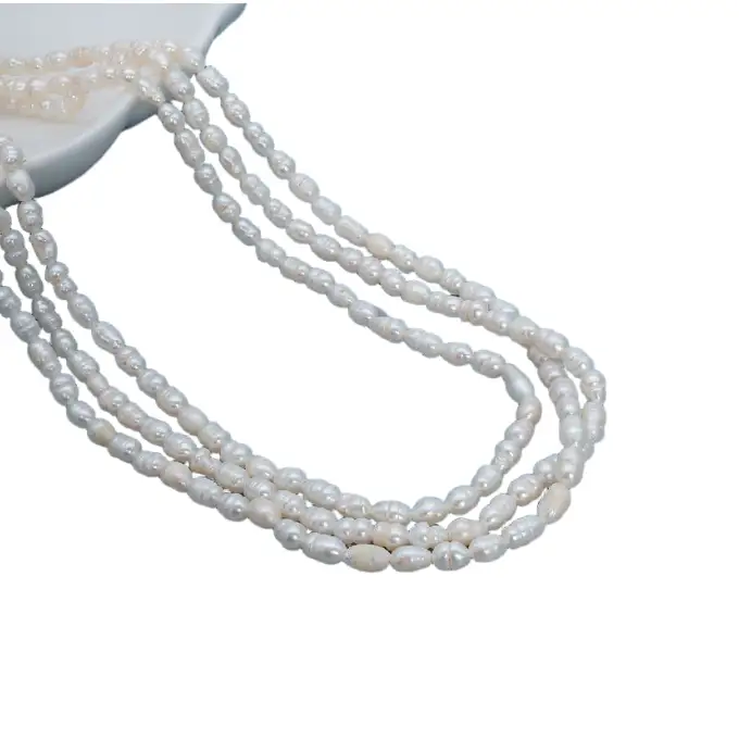 Collar de perlas de agua dulce en forma de arroz de tres hebras, grado AA, de 3 a 4 mm, con cierre de plata de ley 925. 1