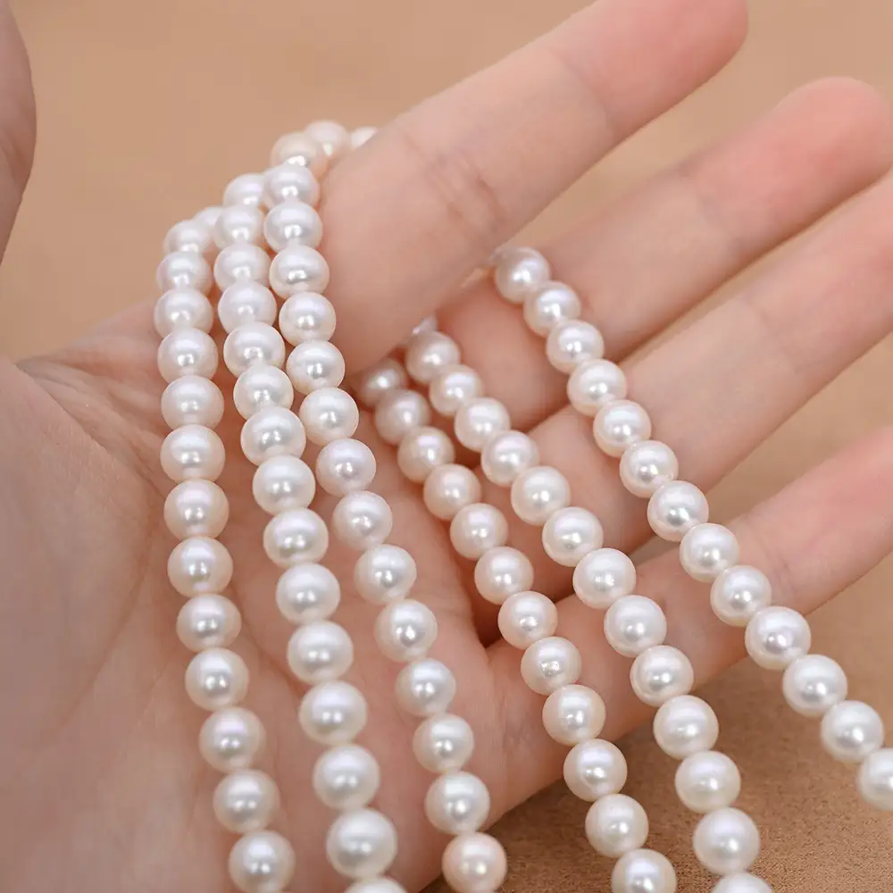 Hilo de perlas redondas naturales de agua dulce blancas AAAA de 6-7 mm para la fabricación de joyas. 1