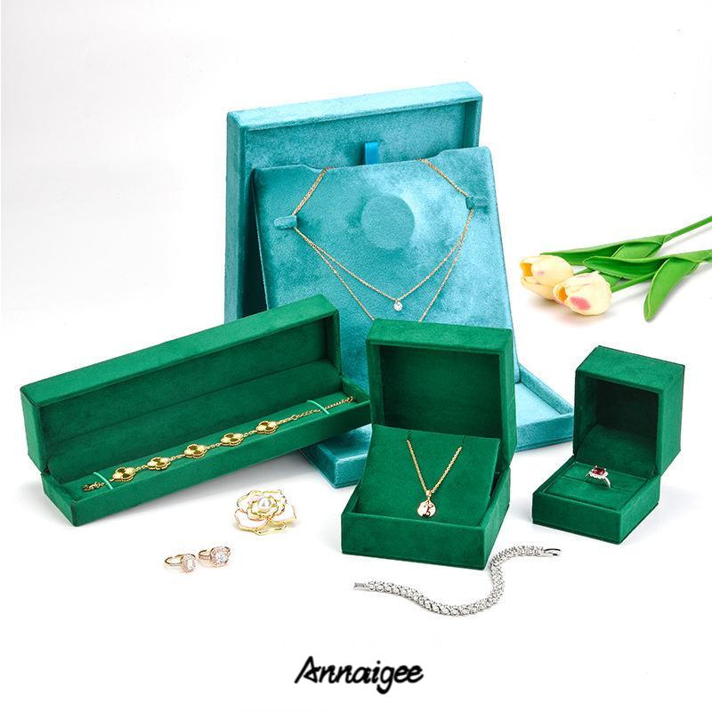 Close-up of personalized gold foil stamp logo on premium velvet jewelry box surface