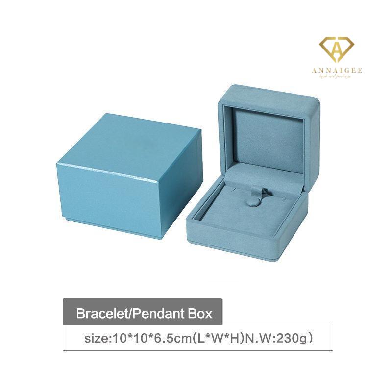 Blue microfiber jewelry box interior with compartments for multiple rings and earrings