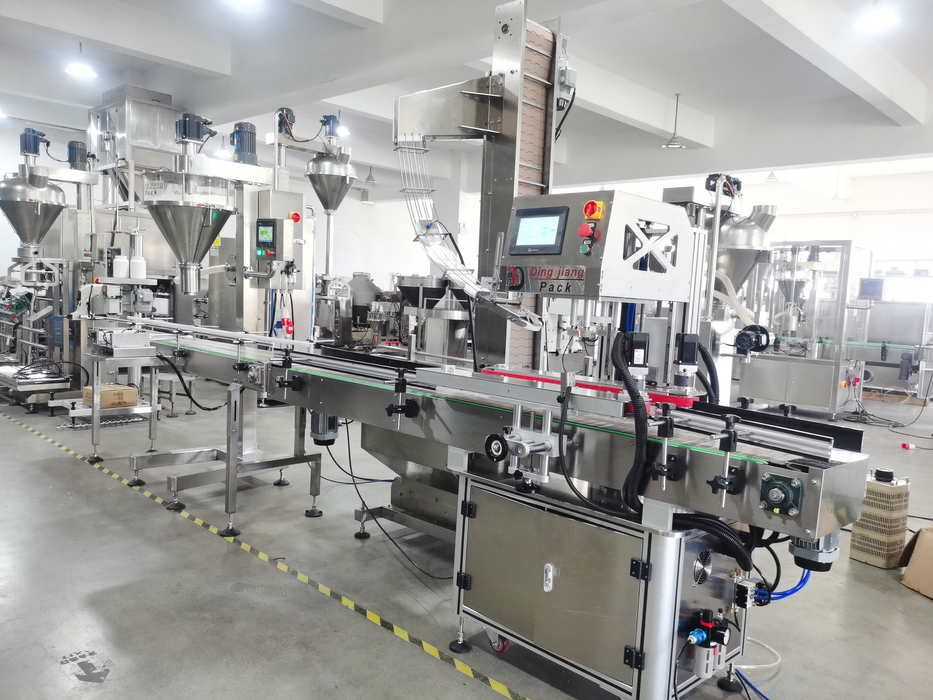 Stainless steel protein powder packaging equipment with integrated dust removal system. 