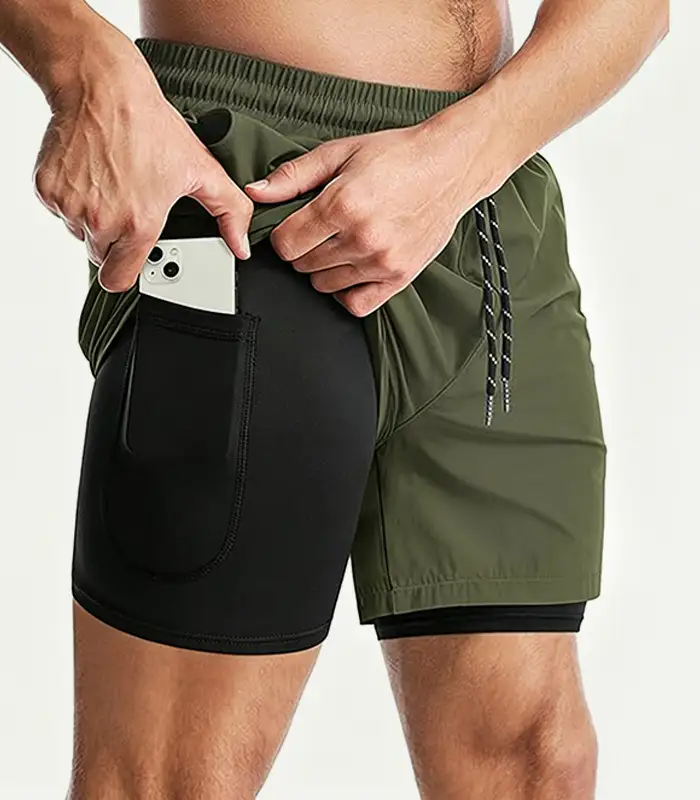 Pantalones deportivos 2 en 1 personalizados para hombre, verano, shorts de dos capas de 5 pulgadas, pantalones casuales deportivos con cintura elástica y cierre de cordón. Proveedor mayorista Kangnai Apparel. 1