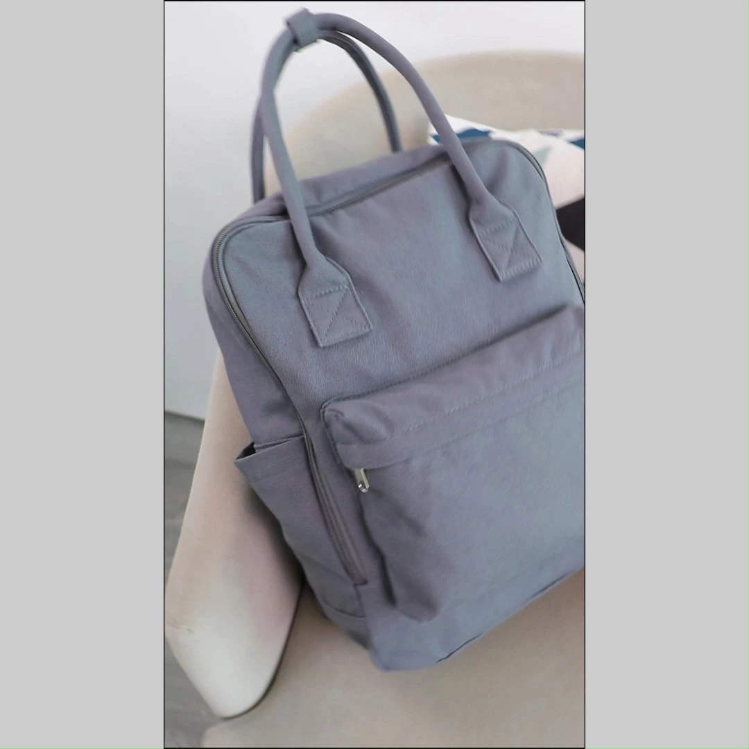 Grey unisex casual canvas backpack school bag with two handles 1
