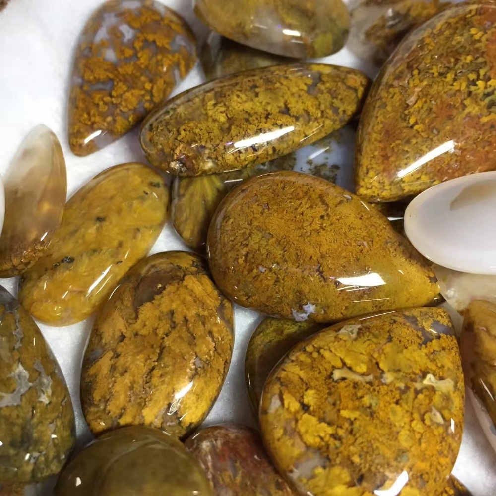 Còinneach buidhe nàdarra ag thoirt a-steach stoc gèilleadh ceòthach loval Còinneach buidhe nàdarra ag agate gemso lomose cabocho oval 44