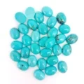 Turquoise Nàdarra 7mm * 9mm Turquoise Smooth Cabochons Oval Cabochons Gems Àrd-inbhe Clachan Gems Fuasgladh Airson Dèan seudaireachd 1