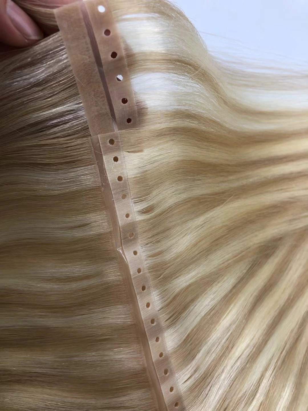 Trama dei capelli del nastro iniettabile di trama dell'unità di elaborazione all'ingrosso con l'estensione dei capelli umani di trama del foro xo 1