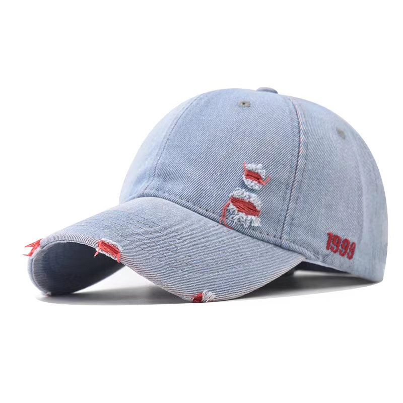 Light blue distressed baseball cap with red accents and tonal panel stitching.