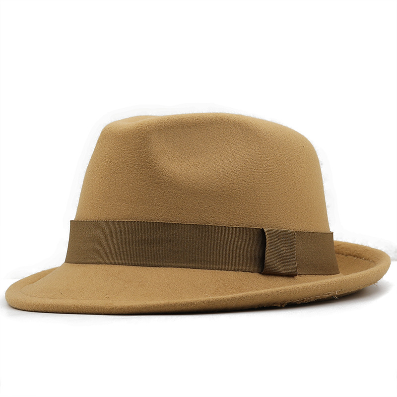 Camel-colored fedora with a brown ribbon band and an upturned brim edge.